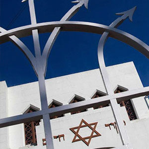 A building with a star of david on the top.