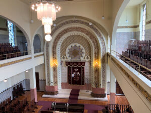 A large room with many arches and a chandelier.