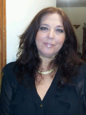 A woman with long hair wearing a black shirt.