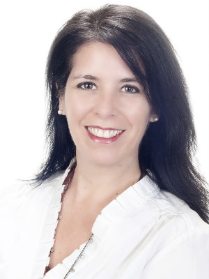 A woman with long black hair wearing white shirt.